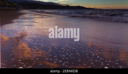 Beautiful sunset over Las Canteras beach in Las Palmas de Gran Canaria Stock Photo