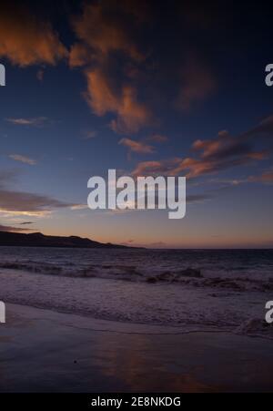 Beautiful sunset over Las Canteras beach in Las Palmas de Gran Canaria Stock Photo