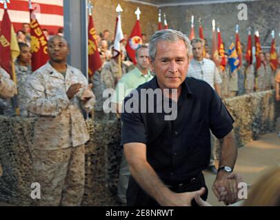 US service members gather around President George W. Bush, who shakes numerous hands, during his surprise visit to Al Asad Air Base, Iraq on September 3, 2007. Bush was joined by Secretary of Defense Robert Gates, Secretary of State Condolezza Rice, Chairman of the Joint Chiefs of Staff Gen. Peter Pace and others. Photo by DOD via ABACAPRESS.COM Stock Photo