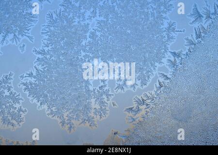 Elaborate and beautiful ice crystal patterns form on my window when it gets below -20C here in Ottawa, Ontario, Canada. Stock Photo