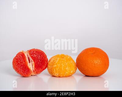 fruit exotic mix, orange, grapefruit, white background, many details, free space for text Stock Photo