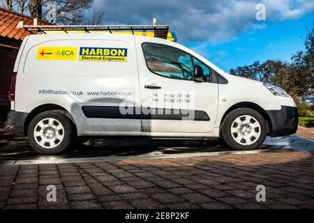 White electricians work van parked at. a private location Stock Photo