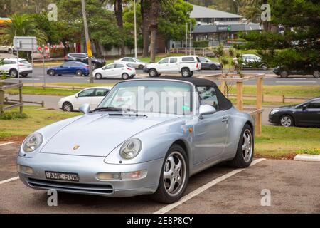 Porsche 911 carrera 4 soft top model in grey silver parked in Sydney,NSW,Australia a classic 2 door sports car Stock Photo