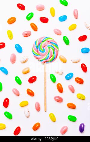 Lollipop and jelly candies on white background. Top view Stock Photo