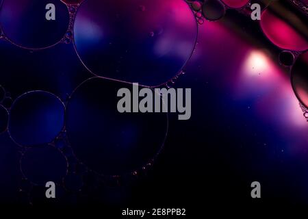Oil drops on a water surface. Abstract and background. Stock Photo