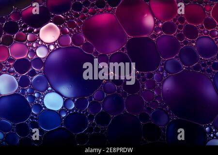 Oil drops on a water surface. Abstract and background. Stock Photo