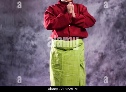 Acehnese traditional clothes with sizes for children are used as clothes for Saman dancers. Indonesian traditional clothes with bright colors. Sumatra Stock Photo