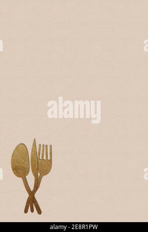 Modern empty background for restaurant menu. Original surreal golden cutlery on empty paper background. Vertical image. Stock Photo
