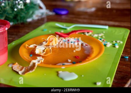 Children can be messy eaters - typical arrangement after eating. Stock Photo