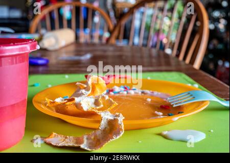 Children can be messy eaters - typical arrangement after eating. Stock Photo