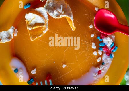 Children can be messy eaters - typical arrangement after eating. Stock Photo