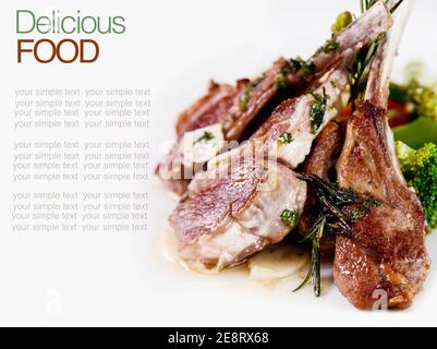 Roasted Lamb Chops with Vegetables and Basil. Stock Photo