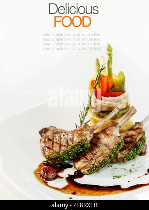 Roasted Lamb Chops with Vegetables and Basil. Stock Photo