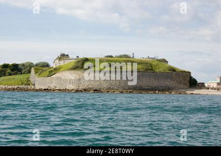 View from the sea of the historic Nothe Forte beside the entrance to Weymouth Harbour, Dorset. Built in 1872 it was much used in World War II. Stock Photo