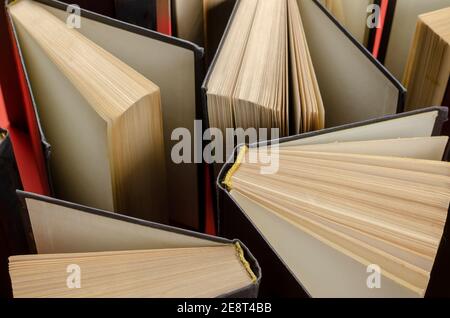 Composition with vintage old hardback books  on  red background. Books open. Back to school.  Education background. Stock Photo