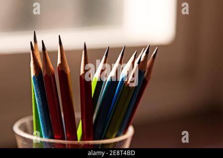 several pencils in backlight by window Stock Photo
