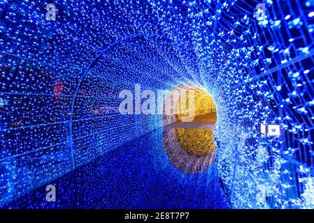 blue lighting tunnel with reflection on ground Stock Photo