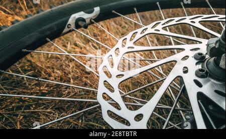 The wheel and the brake disc of the Bicycle on the grass Stock Photo
