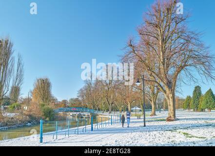 Mother and daughter walk by the river Nene at Beckets Park, Northampton, England, in january 2021 during the national lockdown to combat covid-19. Stock Photo