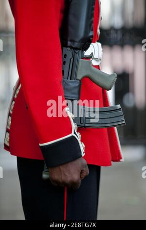 British ceremonial guardsmen with red tunics and bearskin hats parading during the annual Trooping of the Colour ceremony for the Queen's birthday. Stock Photo