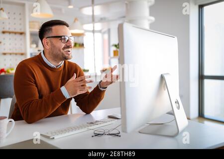 Confident businessman team leader lead group videoconference meeting. Home office concept Stock Photo