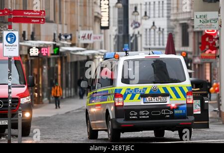 01 February 2021, Saxony-Anhalt, Halle (Saale): A police patrol drives into a pedestrian zone in the center of the city in the morning. Restrictions on public life remain in place throughout the country to contain the Corona pandemic. Photo: Hendrik Schmidt/dpa-Zentralbild/ZB Stock Photo