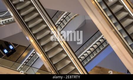 Escalators in modern public library seen from above. Stock Photo