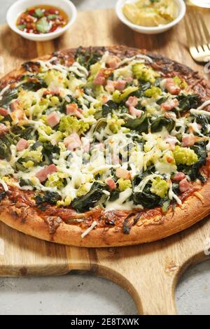 Home made pizza with spinach and cheese Stock Photo