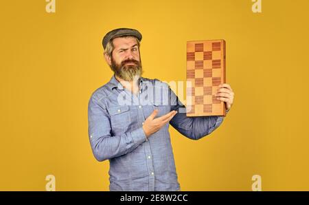 Teacher chess competition. Board game. Bearded man playing chess. Chess figures. Intellectual games. Game strategy concept. Chess lesson. Grandmaster experienced player. Cognitive development. Stock Photo