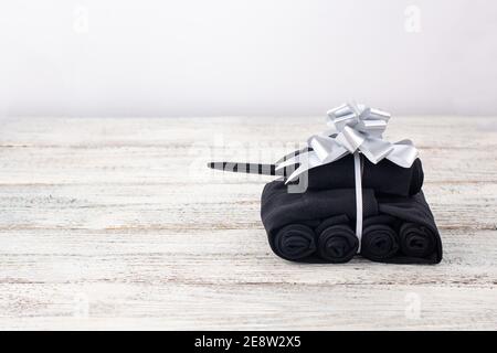 Handmade tanks of socks as gift to men on February 23 on white background with copyspace Stock Photo