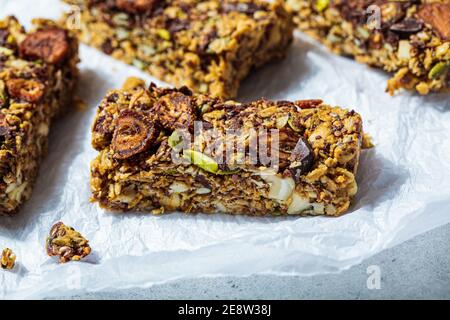 Homemade oat bars with berries and nuts, light background. Energy Protein Healthy Bars. Vegan dessert concept. Stock Photo