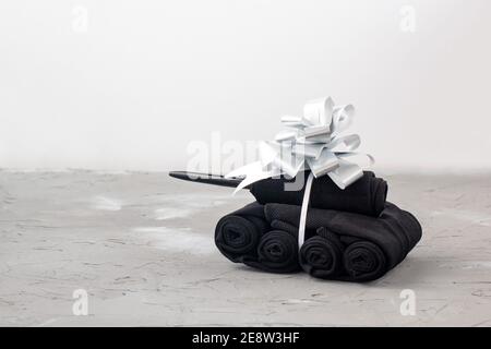 Handmade tanks of socks as gift to men on February 23 on grey background with copyspace Stock Photo