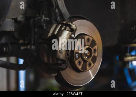 Caliper and brake disc of the front wheel of the car. Stock Photo