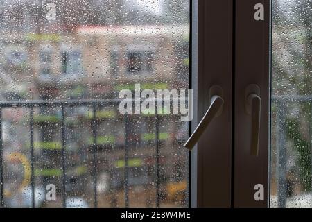 Rainy weather, raindrops on a window pane, Stock Photo