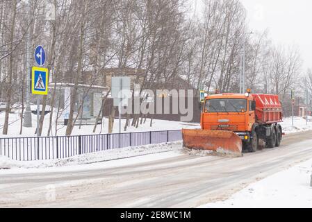 Moscow. Russia. Winter 2021. A large snow plow clears the snow from the road. Stock Photo
