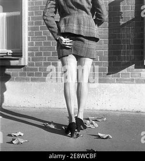 Nylon stockings in the 1950s. The model Solveij Nyhlén pictured outside the swedish factory of nylon stockings, Malmö strumpfabrik. Established 1926 and became the leading manufacturer of silk stockings in sweden. At this time 1951 the company had invested in new machinery to make the popular nylon stockings. Ref BE19-11 Stock Photo
