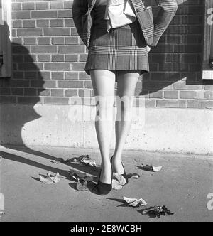 Nylon stockings in the 1950s. The model Solveij Nyhlén pictured outside the swedish factory of nylon stockings, Malmö strumpfabrik. Established 1926 and became the leading manufacturer of silk stockings in sweden. At this time 1951 the company had invested in new machinery to make the popular nylon stockings. Ref BE19-10 Stock Photo