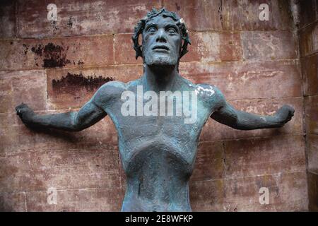 Christ uncrucified statue in old church ruins. Stock Photo
