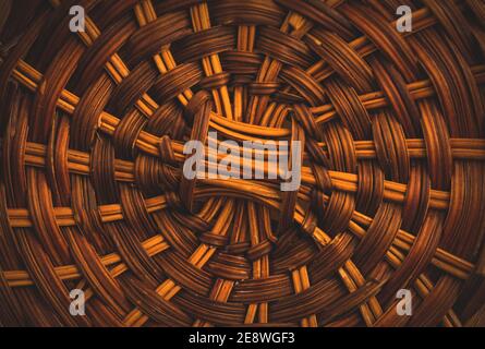 Texture of handmade wicker basket from below, home style furniture, macro background photo Stock Photo