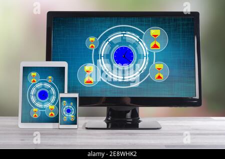 Time management concept shown on different information technology devices Stock Photo
