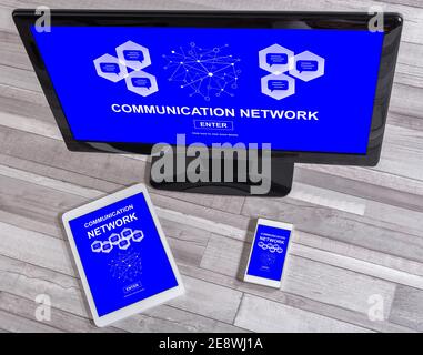 Communication network concept shown on different information technology devices Stock Photo