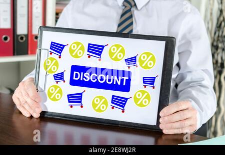 Discount concept shown by a businessman Stock Photo