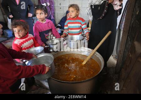 The Gaza Strip, The Gaza Strip, Palestine. 1st Feb, 2021. Palestinians make food and distribute it on poor kids at the Gaza Strip Credit: Hassan Jedi/Quds Net News/ZUMA Wire/Alamy Live News Stock Photo