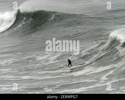 Newquay,Cornwall, 1st February 2021. UK weather: Devon and Jeff Thomas, Petrol power surfing. Cornwall police forced close the huge car park at Towan head Fistral beach after hundreds of spectators arrived to view the spectacle of the biggest waves in many years being ridden by a powered sufboard rider.  Credit: Robert Taylor/Alamy Live News” Stock Photo