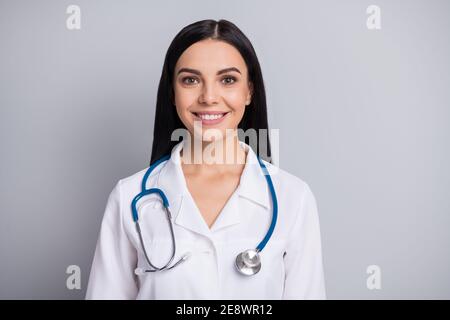Photo of cheerful doctor woman look camera beaming smile wear stethoscope white uniform isolated grey color background Stock Photo