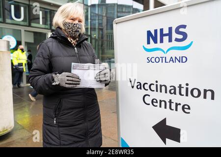 Edinburgh, Scotland, UK. 1 February 2021. Mass Covid-19 vaccination centre opens today at EICC ( Edinburgh International Conference Centre ) in Edinburgh. Members of the public with appointments arrive for their vaccinations. Pic; Joyce Tucker from Edinburgh arrives with her appointment letter from NHS Scotland. Iain Masterton/Alamy Live News Stock Photo