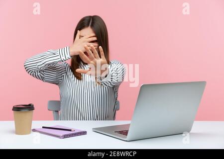 Work Scared Scared young office worker hiding under his working desk during ...