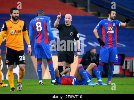 Crystal Palace's Jordan Ayew (floor) goes down injured during the Premier League match at Selhurst Park, London. Picture date: Saturday January 30, 2021. Stock Photo