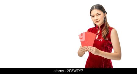 Happy beautiful young Chinese woman in red chinese dress holding red money envelopes against white background with copyspace Stock Photo