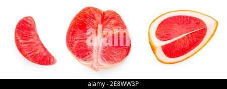 Creative layout made of Grapefruits  isolated on white background. Pink grapefruit slices and wedges Flat lay. Top view. Stock Photo